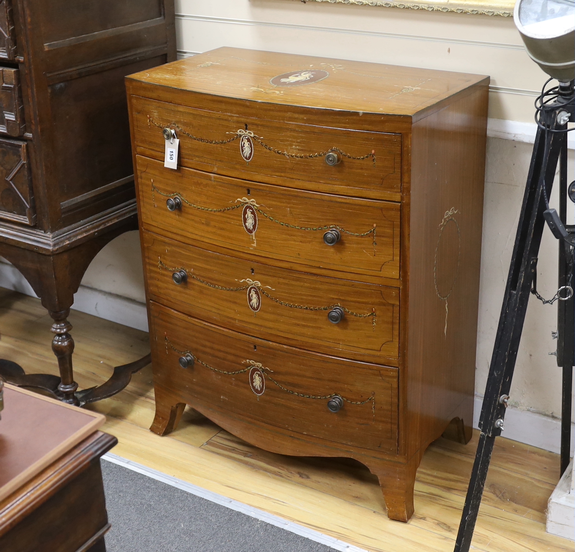 An early 20th century Sheraton revival painted satinwood bow front chest, width 76cm, depth 43cm, height 98cm